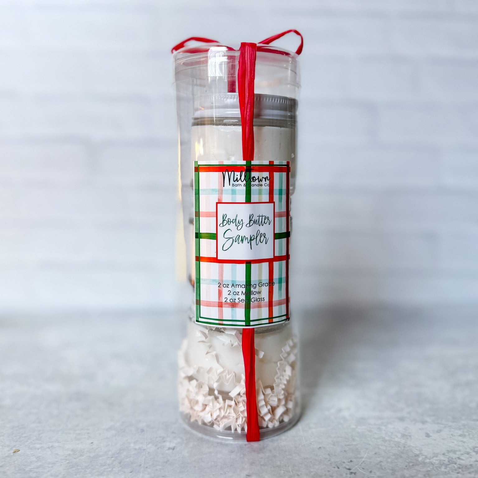 Body butter sampler with a plaid label on a white background Thomaston, GA